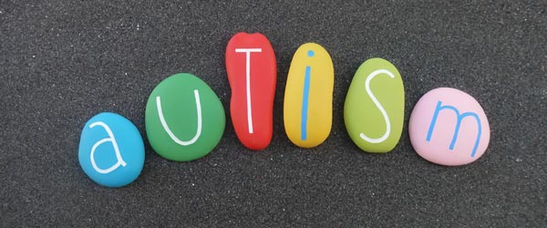 autism spelled out with colorful rocks